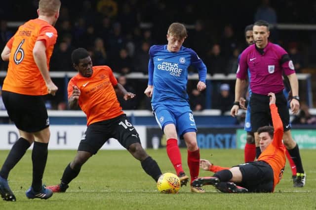 Posh midfielder Chris Forrester skips past two Southend challenges. Photo: Joe Dent/theposh.com.