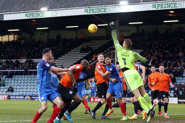 Southend goalkeeper Mark Oxley clears a cross in the win at Posh. Photo: Joe Dent/theposh.com.
