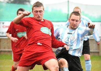 Adam Millson (red) scored for Wisbech at ON Chenecks.