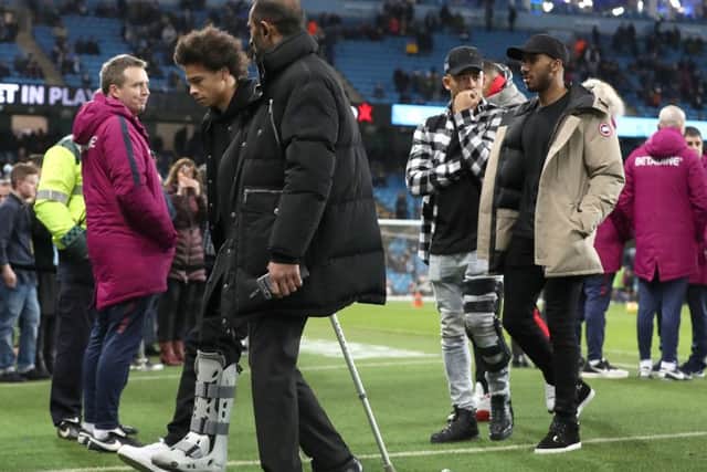 Crocked Manchester City star Leroy Sane (on crutches).