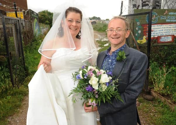 Alun Williams and Melanie Addison host their wedding reception at the Green Back Yard, where they met as volunteers. ENGEMN00120120408202754