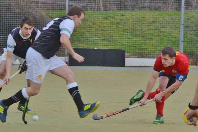 City of Peterborough skipper Ross Booth (red) in action in an 8-1 win over Cambridge University. Photo: David Lowndes.