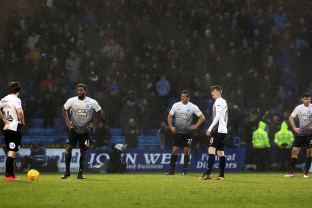 Posh players are dejected after conceding a late equaliser at Gillingham. Photo: Joe Dent/theposh.com.