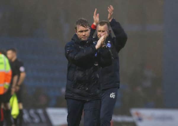 Posh boss Grant McCann acknowledges the visiting support at the end of the match at Gillingham. Photo: Joe Dent/theposh.com.