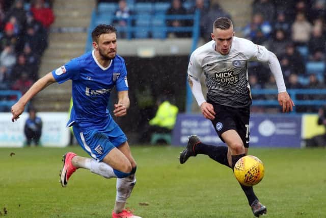 Joe Ward of Posh takes on Gillingham's Luke O'Neill. Photo: Joe Dent/theposh.com.