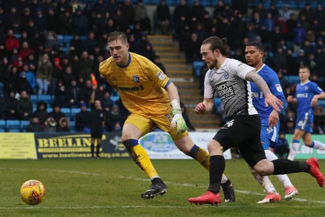 Posh striker Jack Marriott tries to get round Gillingham goalkeeper Tomas Holy. Photo: Joe Dent/theposh.com.
