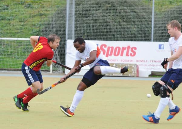 Joe Finding (red) scored twice for City of Peterborough at St Albans.