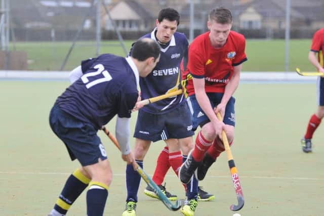 Ross Ambler (red) scored for City of Peterborough at St Albans.
