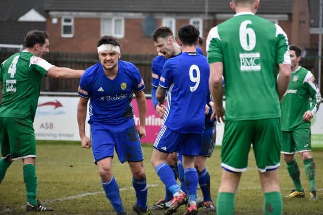 Peterborough Sports players celebrate Josh Moreman's goal against Frickley. Photo: James Richardson.