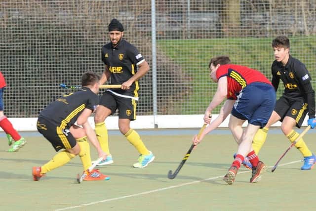 James Fisher (red) clears his lines for City of Peterborough against Beeston. . Photo: David Lowndes.