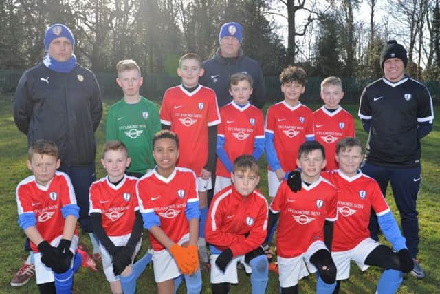 Feeder Soccer Under 12s are pictured before their 3-1 win over Hampton Royal in the Under 12 League Cup. Pictured from the left are, back, Elliott Parry, Harvey Hutchings, Lewis Lilley, Ian Hutchings, Owen Hill, Jamie Graham, Mckenzie Neilly, Nicky Garner, front, Ethan Ketteringham, Archie Thompson, Liam Bello-Matthews, George Lord, Connor Leaves and Mason Clarke,