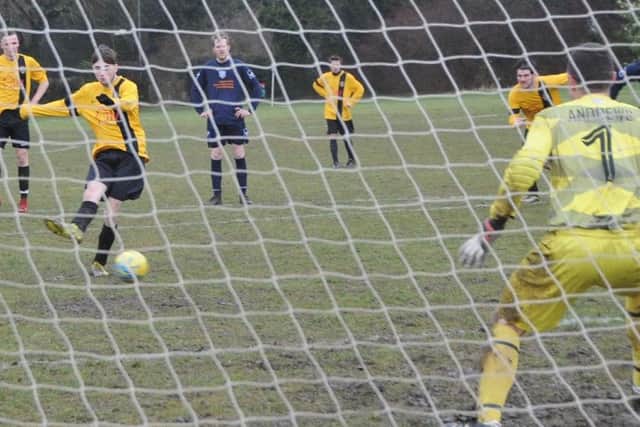 Glinton & Northborough Reserves score from the spot at AFC Orton.  Photo: David Lowndes.