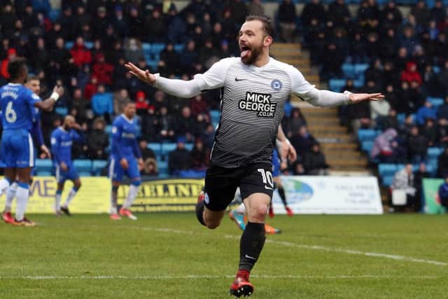 Danny Lloyd celebrates his goal for Posh against Gillingham.