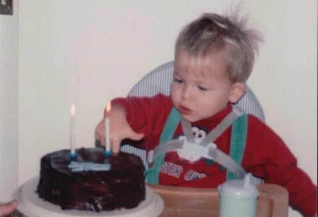 A young Andrew celebrating his birthday