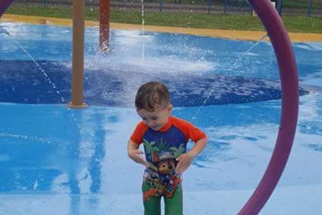 Three-year-old Hugo having fun at the water park