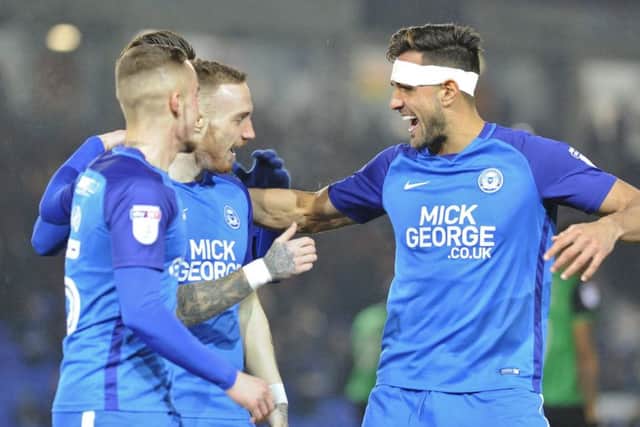 Posh players celebrate Marcus Maddison's early goal against Scunthorpe. Photo: David Lowndes.