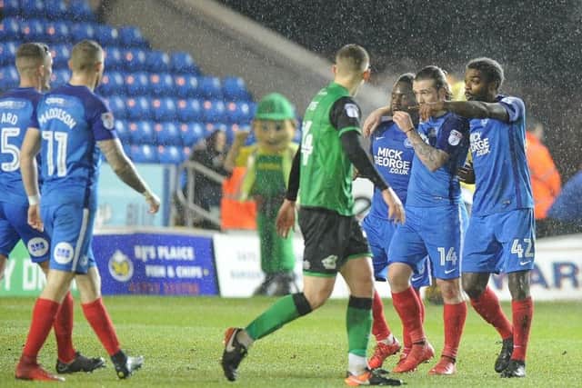 Posh players celebrate a goal from Junior Morias (third right) against Scunthorpe. Photo: David Lowndes.
