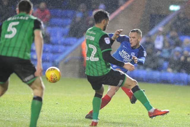 Posh player Joe Ward takes a shot at the Scunthorpe goal. Photo: David Lowndes.