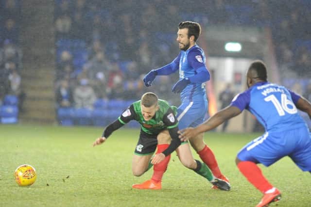 Michael Doughty in the thick of the action for Posh against Scunthorpe. Photo: David Lowndes.