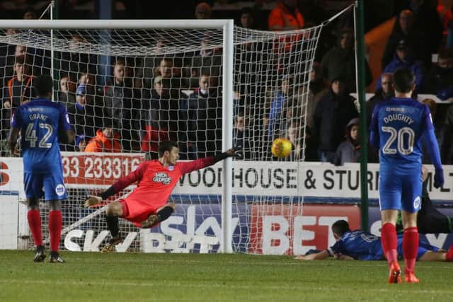 Posh goalkeeper Jonathan Bond makes a key save during the 2-2 draw against Scunthorpe. Photo: Joe Dent/theposh.com.