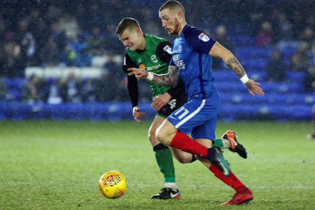 Posh star Marcus Maddison takes on Scunthorpe's Ryan Yates. Photo: Joe Dent/theposh.com.