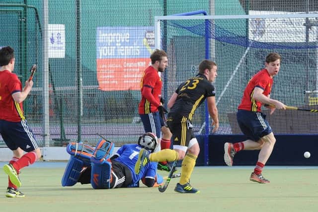 Action from City of Peterborough's (red) defeat at the hands of Beeston. Photo; David Lowndes.