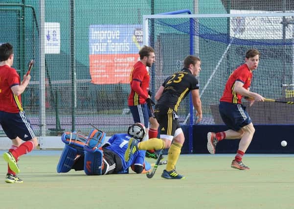 Action from City of Peterborough's (red) defeat at the hands of Beeston. Photo; David Lowndes.