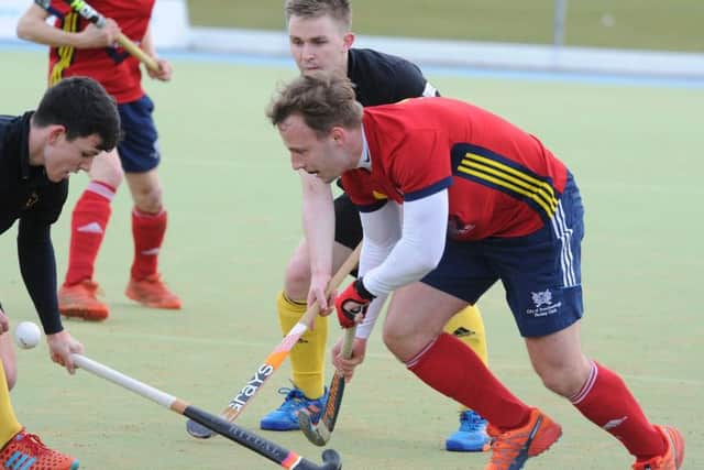 Action from City of Peterborough's (red) defeat at the hands of Beeston. Photo; David Lowndes.