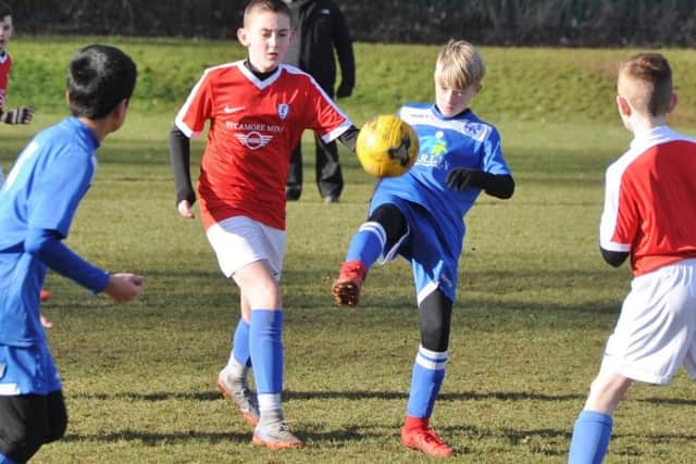 Action from the game between Feeder Soccer Under 12s and Hampton Royals.