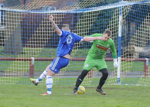 Action from Peterborough Polonia's PFA Senior Cup win over ICA Sport (blue). Photo: David Lowndes.