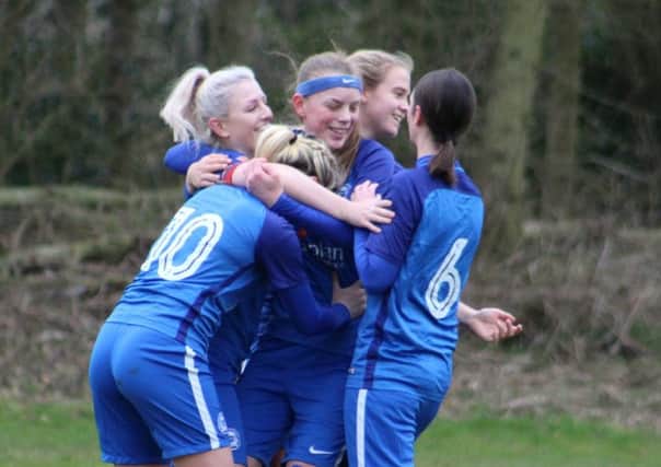 Jess Driscoll, Emily Smith, Keir Perkins, Jeorgia Carr and Kathryn Lusk celebrate a Posh goal during the win over Northampton. Picture: Gary Reed