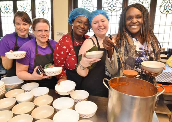 Food Cycle weekly lunch at Park Road Baptist Church. MP for Peterborough Fiona Onasanya with some of the volunteers at the event -  Yuki de Aguiar, Heather Skibsted, Sadi Oyewole and Anouski Kruczek EMN-181202-152248009
