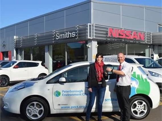 Independent charity Peterborough Environment City Trust picking up a Nissan Leaf from the city's dealership. (Photo PECT)