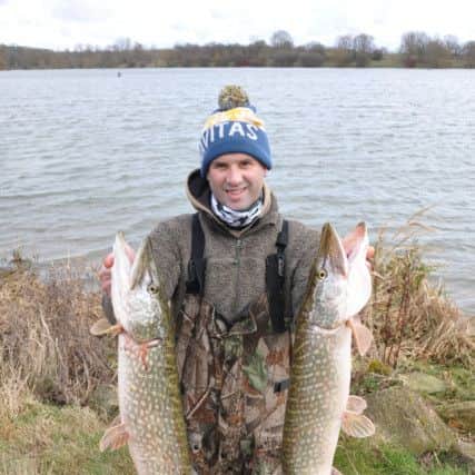 Chris Morton with two good fish taken from Gunwade Lake at Ferry Meadows.