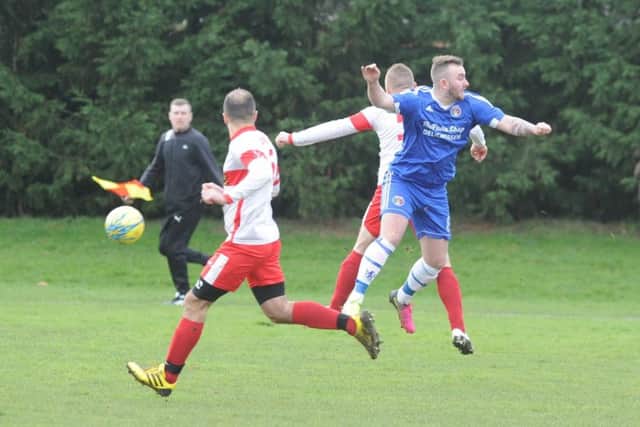 Action from Peterborough Polonia's PFA Senior Cup semi final win over ICA Sports (blue). Photo: David Lowndes.
