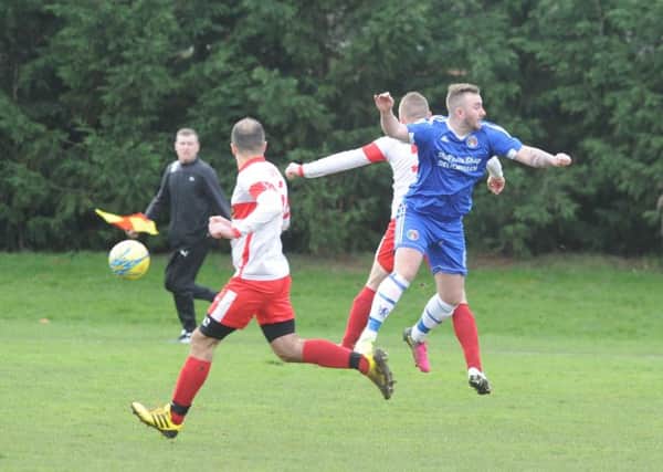 Action from Peterborough Polonia's PFA Senior Cup semi final win over ICA Sports (blue). Photo: David Lowndes.
