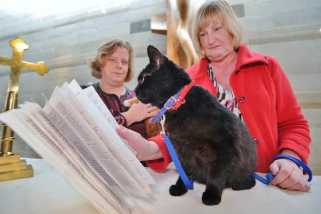 Pet service at St Mary's Church, New Road. Pictured  are  Claudia Butler and Tina Karimi with her cat Whoo-Whoo. EMN-180217-175114009
