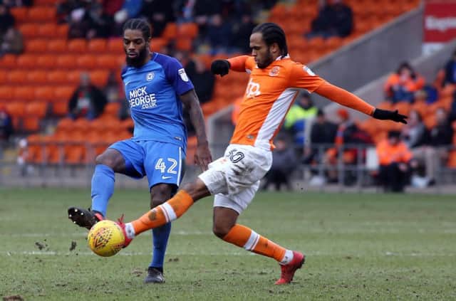 Anthony Grant of Peterborough United in action with Nathan Delfouneso of Blackpool - Mandatory by-line: Joe Dent/JMP - 18/02/2018 - FOOTBALL - Bloomfield Road - Blackpool, England - Blackpool v Peterborough United - Sky Bet League One EMN-180220-163856002