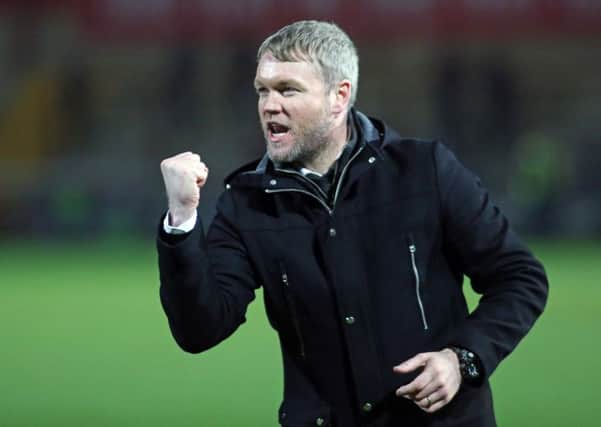 Will Posh manager Grant McCann be celebrating in May?