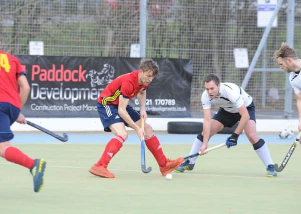 Ben Read (red) on the ball during City of Peterborough's 4-3 win over Harleston. Photo: David Lowndes.