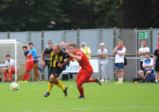 Tom Gosling (left) playing for Holbeach United.