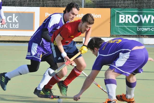 Adam Wilson (red) in action for City of Peterborough against Saffron Walden. Photo: David Lowndes.
