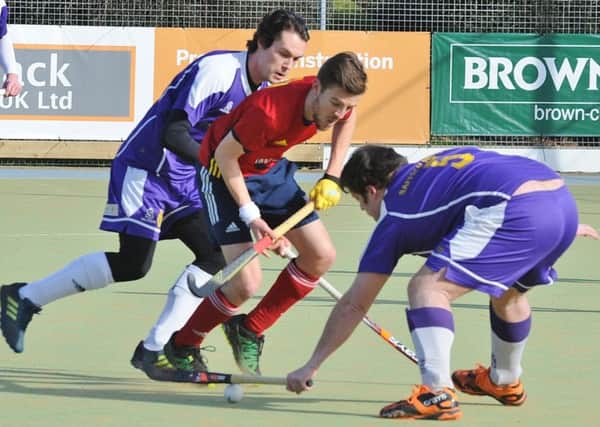 Adam Wilson (red) in action for City of Peterborough against Saffron Walden. Photo: David Lowndes.