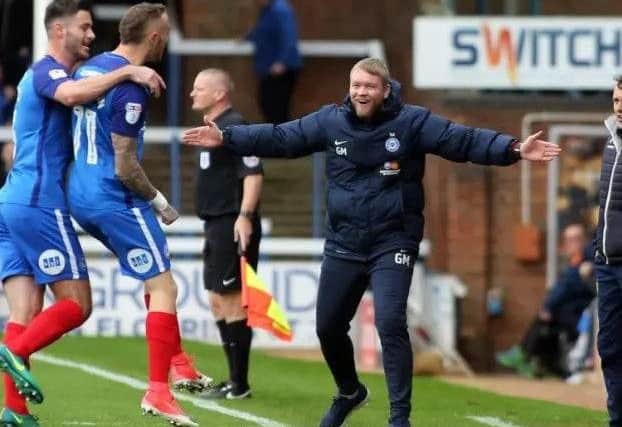 Grant McCann celebrates a JMarcus Maddison goal.