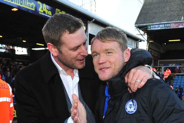 Grant McCann (right) the Posh player with chairman Darragh MacAnthony in 2013.