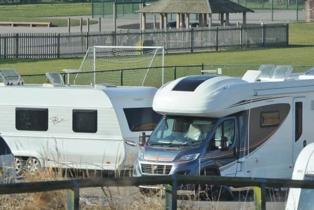 Travellers in the centre's car park