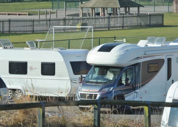 Travellers in the centre's car park