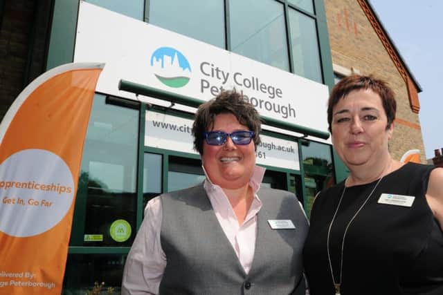 Pat Carrington (right) outside City College Peterborough