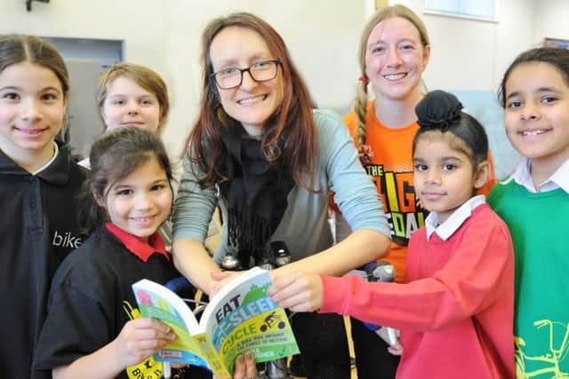 Round Britain's Coasts cyclist Anna Hughes with Gemma Hughes from Sustrans and pupils at Longthorpe Primary School EMN-180226-160656009
