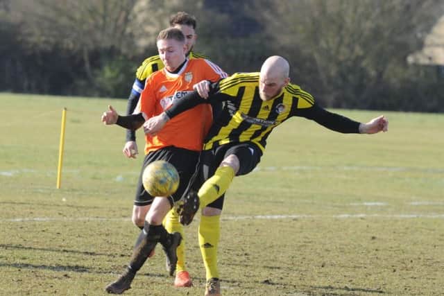 Action from Thorney (orange) v Holbeach United Reserves in the semi-final of the President's Shield. Photo: David Lowndes.